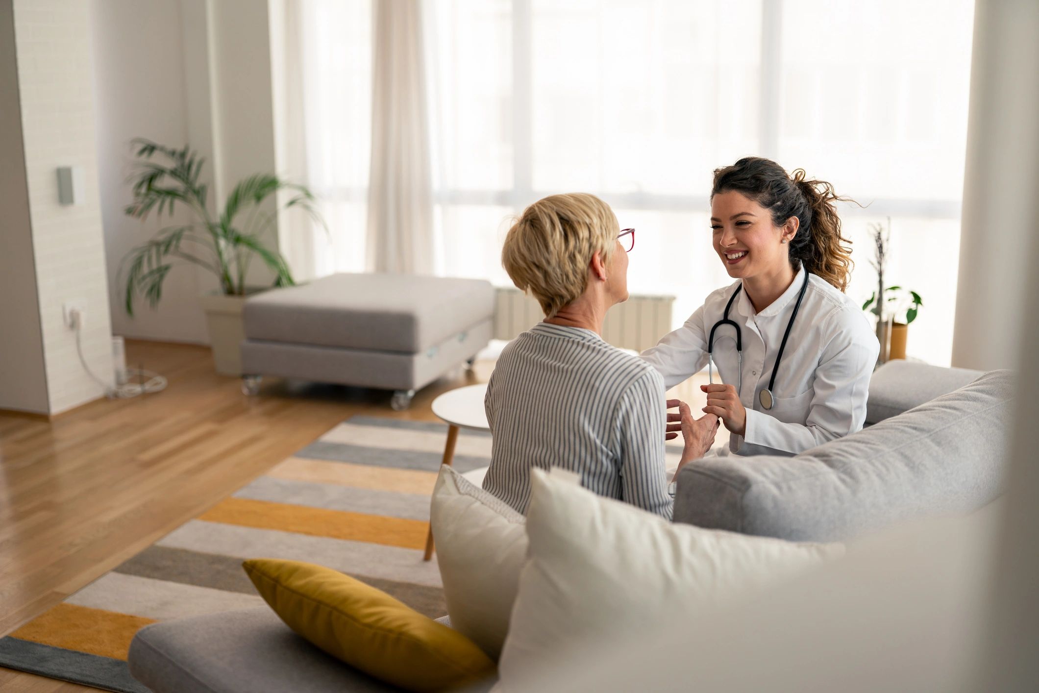 Nurse providing a friendly in-home healthcare consultation